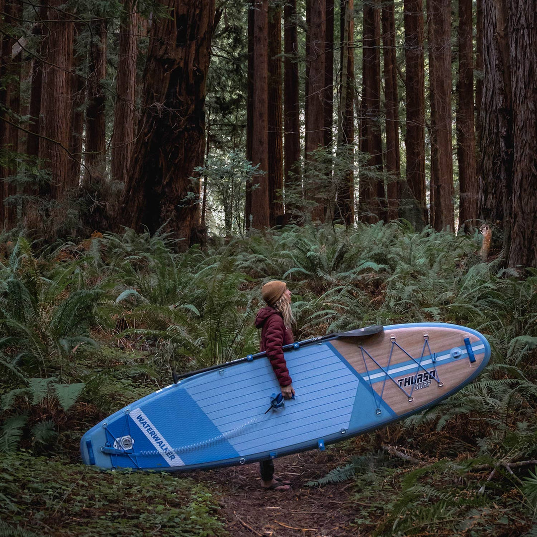 woman carrying waterwalker 126 dusk in woods