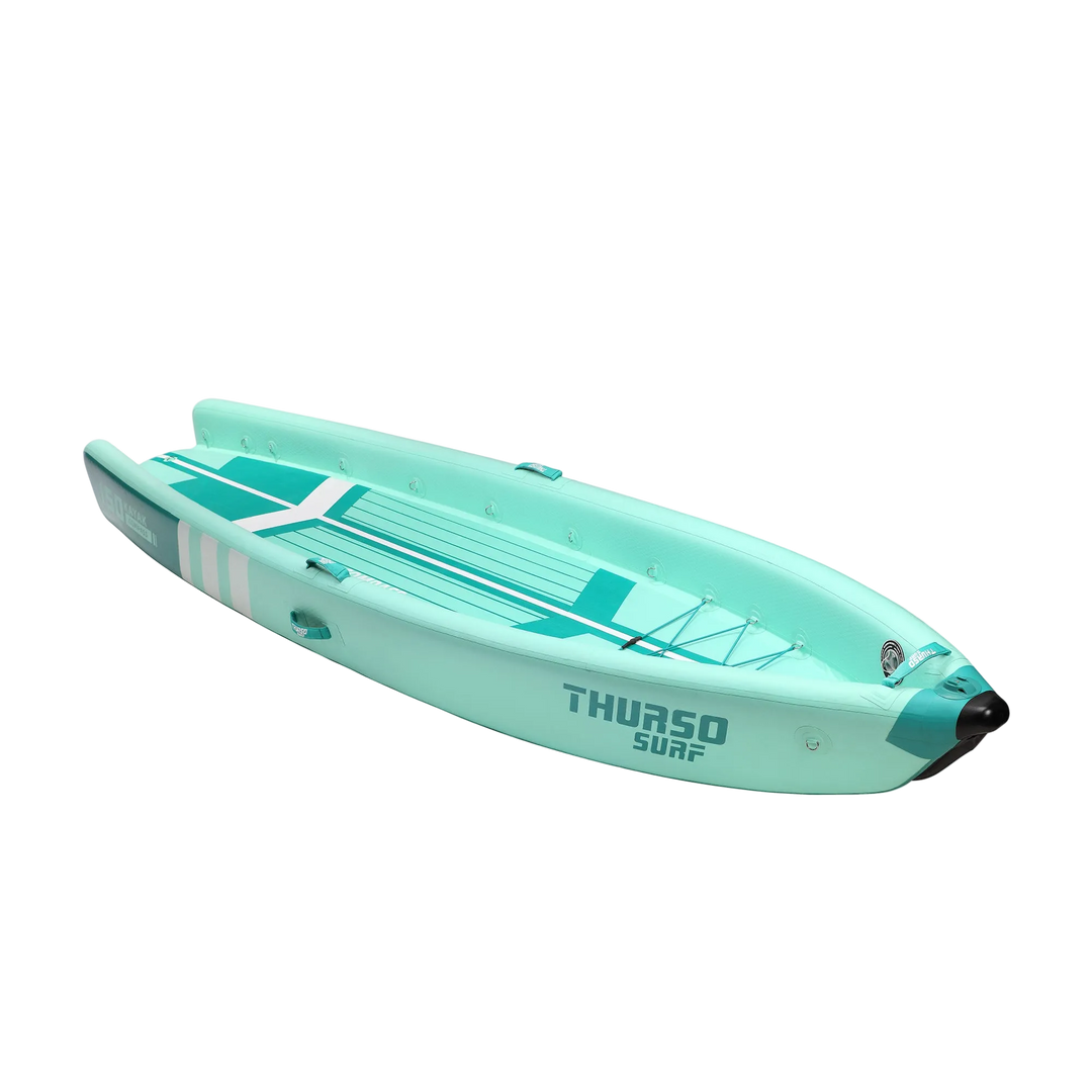 Turquoise inflatable kayak with 'Thurso Surf' branding on a white background