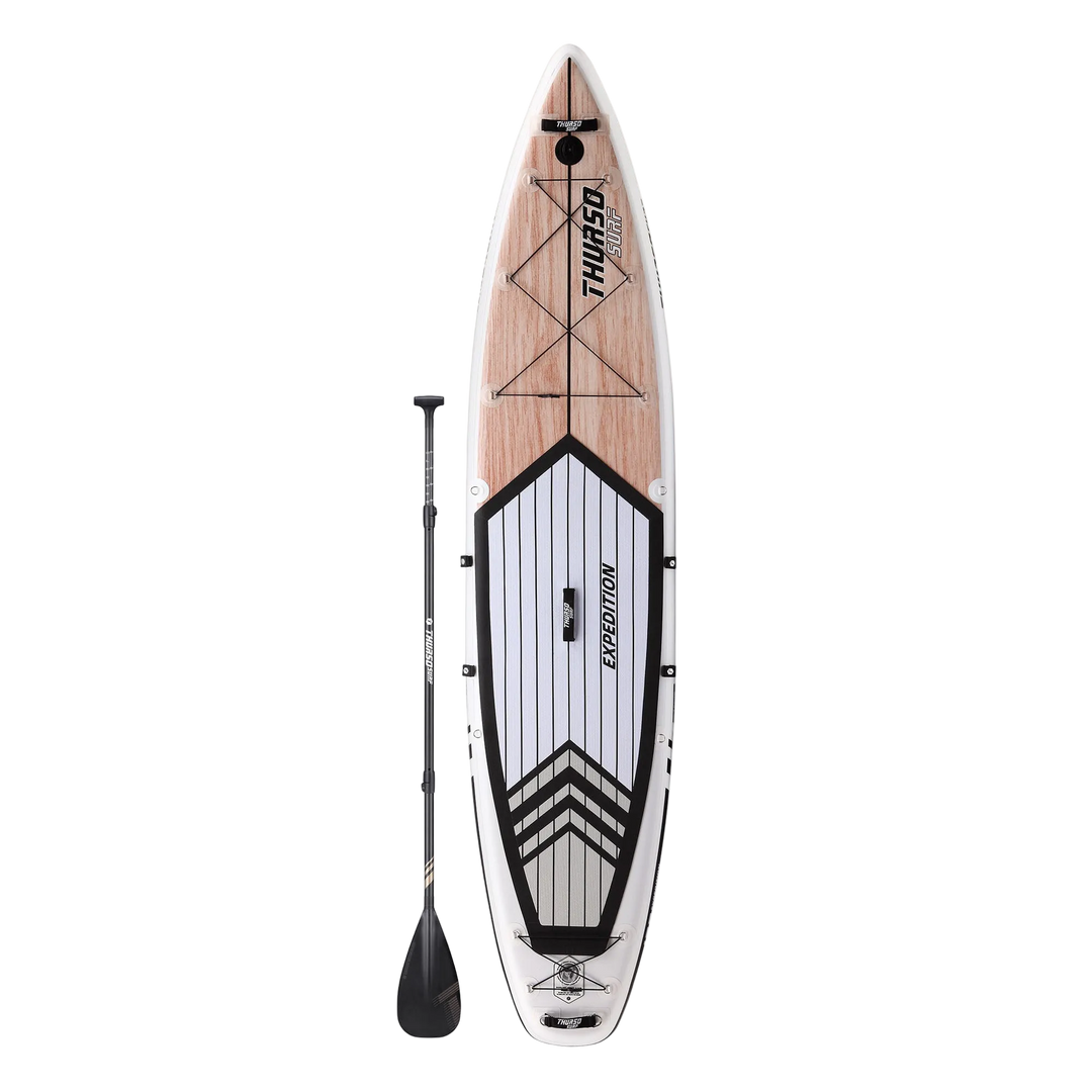 Inflatable stand-up paddleboard with wooden deck and black paddle on a white background