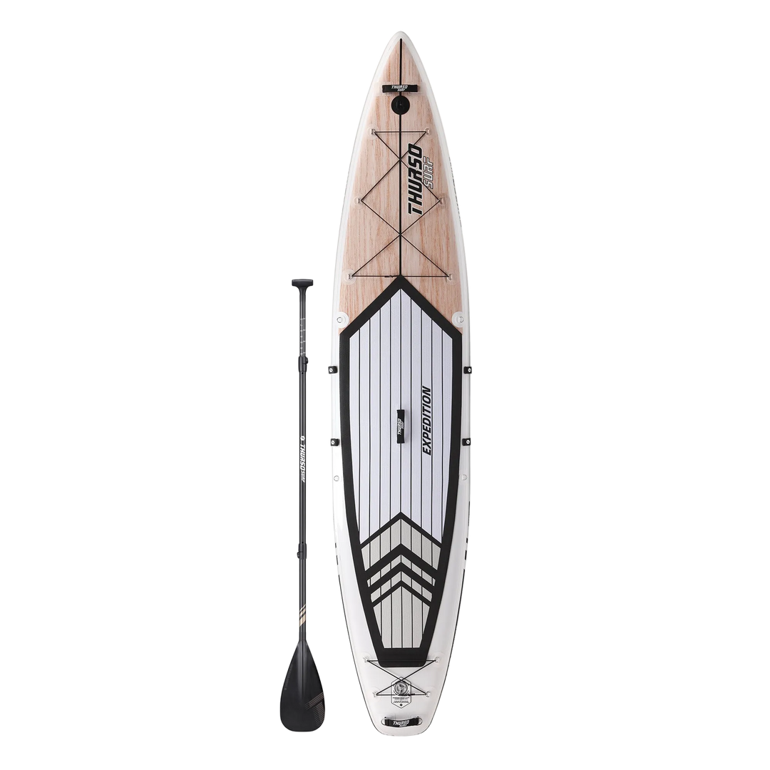 Inflatable paddle board with wooden deck and Thule branding on a white background