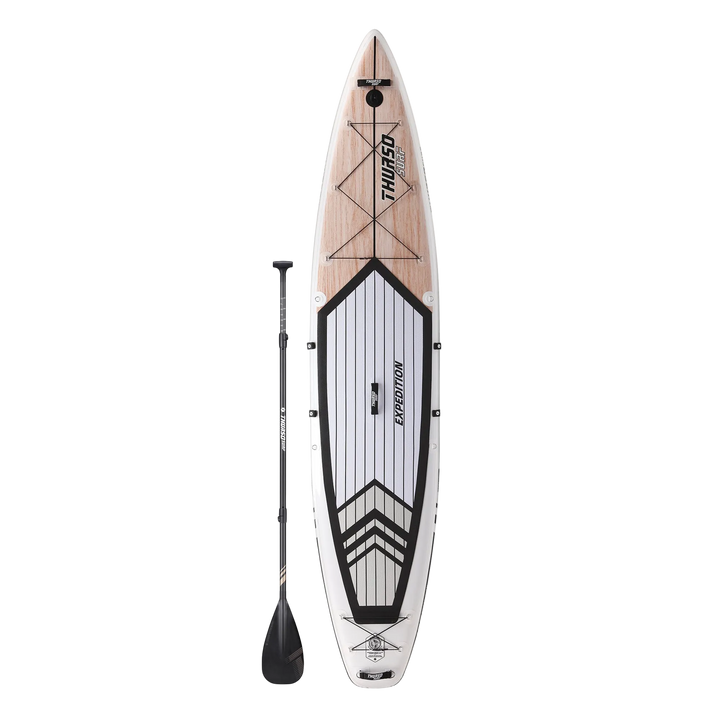 Inflatable paddle board with wooden deck and Thule branding on a white background