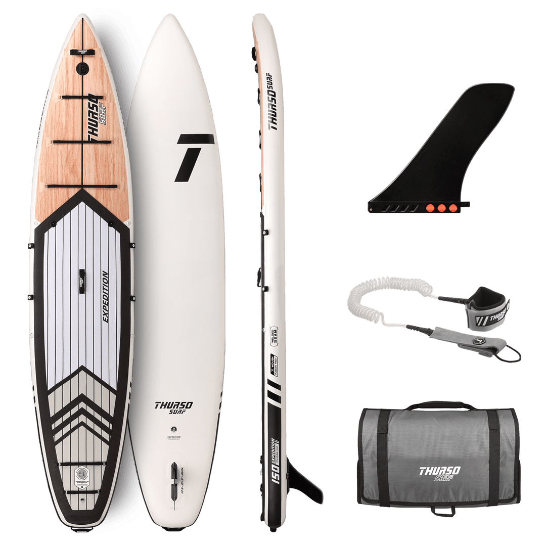 Paddleboard set with board, fin, leash, and bag on a black background