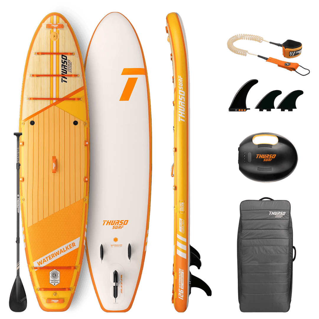 Orange and white Thurso Surf paddleboard with accessories on a black background