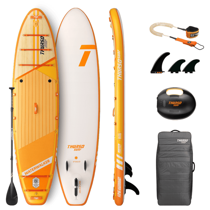 Orange and white Thurso Surf paddleboard with accessories on a black background