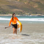 thurso surf waterwalker 132 SUP 2021 tangerine woman carrying walking