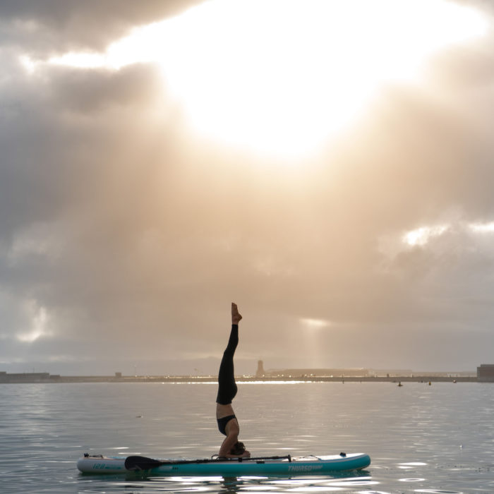 thurso surf tranquility paddle board lifestyle headstand